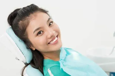 woman laying in the dental chair at Pocock Family Dental