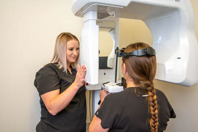 patient getting dental X-rays during their first appointment at Pocock Family Dental