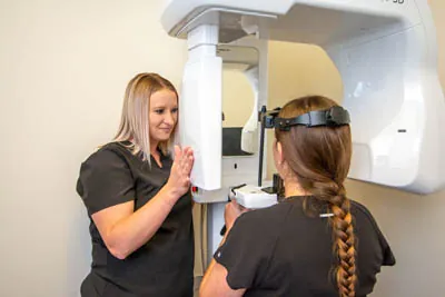 patient getting dental X-rays during their first appointment at Pocock Family Dental