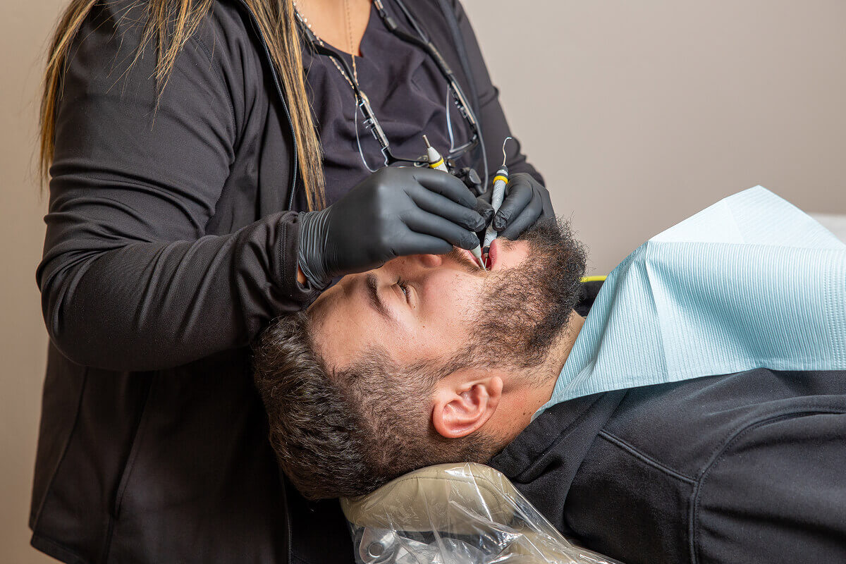 A patient in an exam chair receiving treatment for a dental emergency at Pocock Family Dental in Twin Falls ID.